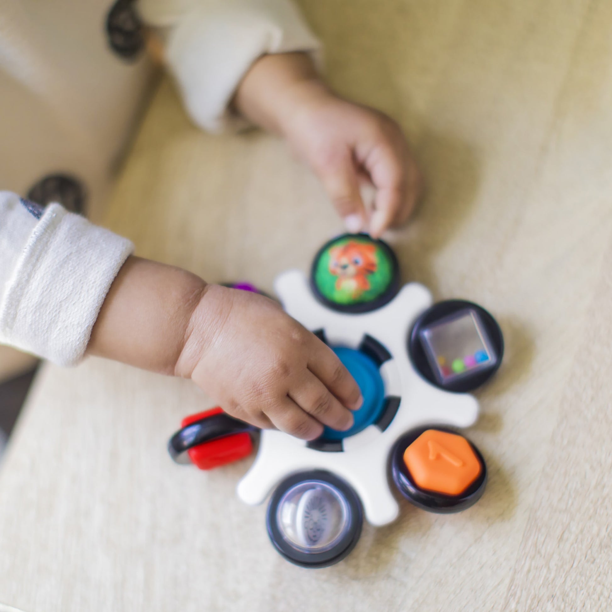 Baby Einstein Curiosity Clutch Twist and Pop Rattle Teether Infant Toy for Discovering Textures, Colors, Shapes, 3 Months+